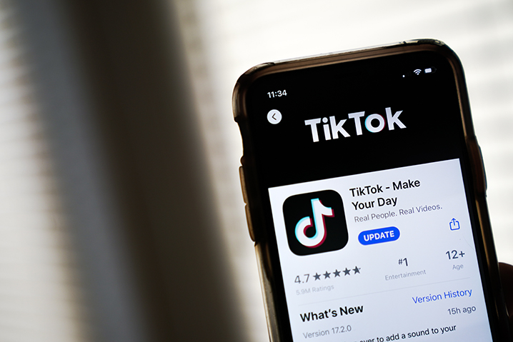 In this photo illustration, the download page for the TikTok app is displayed on an Apple iPhone