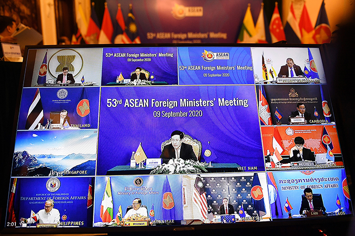 Vietnam's Foreign Minister Pham Binh Minh and Foreign ministers from ASEAN countries are seen on a television screen during the 53rd ASEAN Foreign Ministers' Meeting